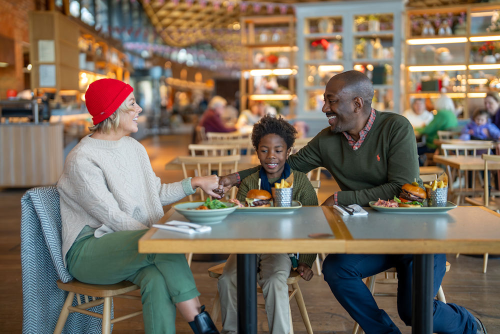 Family eating in The Savill Garden Kitchen